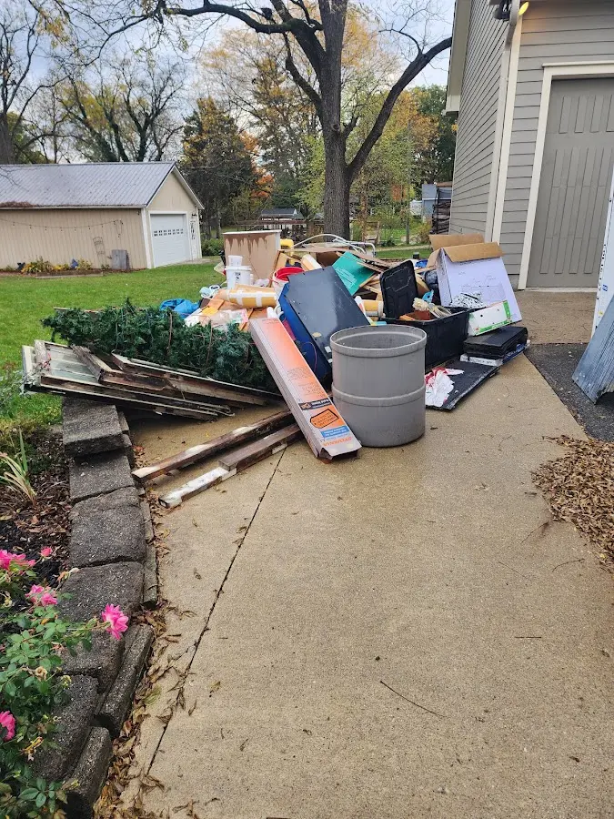Dumpster being loaded with debris for Roofing Dumpster Rental in Emeryville